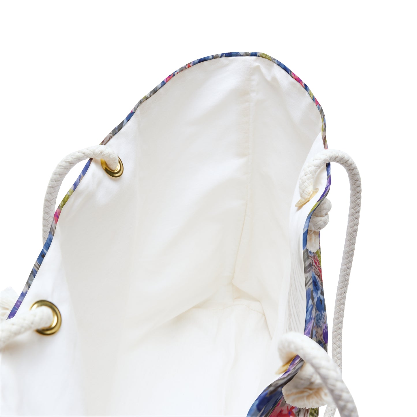 White inside of Blue and pink watercolor wildflower weekender bag with a vibrant meadow floral pattern and white rope handles, designed as a spacious travel tote for beach trips and weekend getaways.