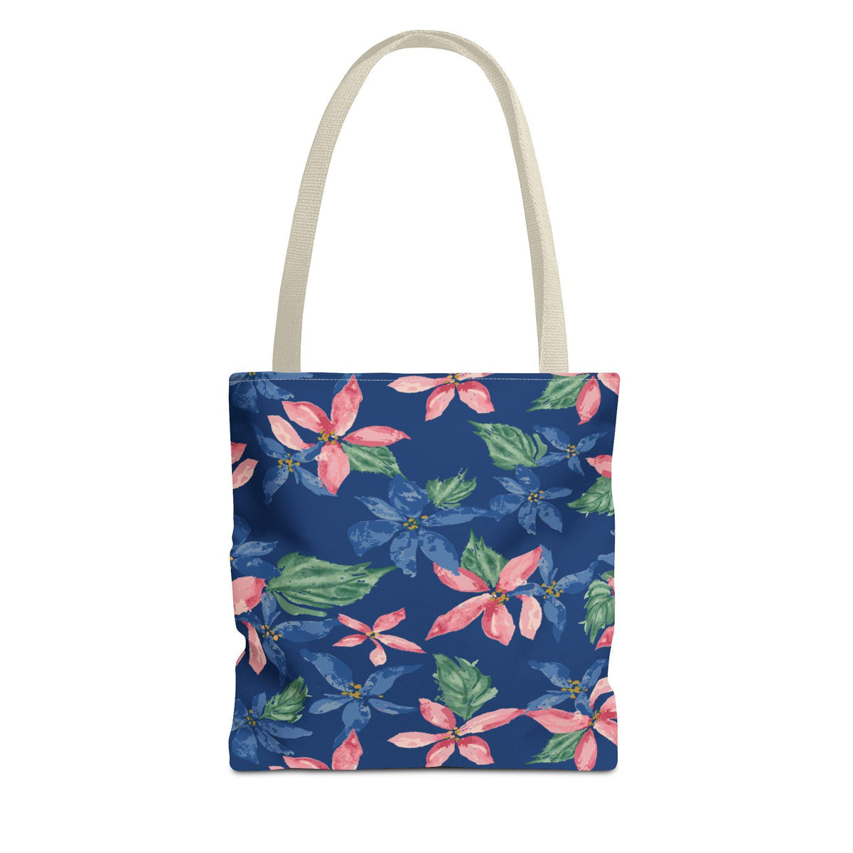 A tote bag with a navy blue background and a floral pattern. The flowers are pink and blue with green leaves. The bag has a cream-colored handle.