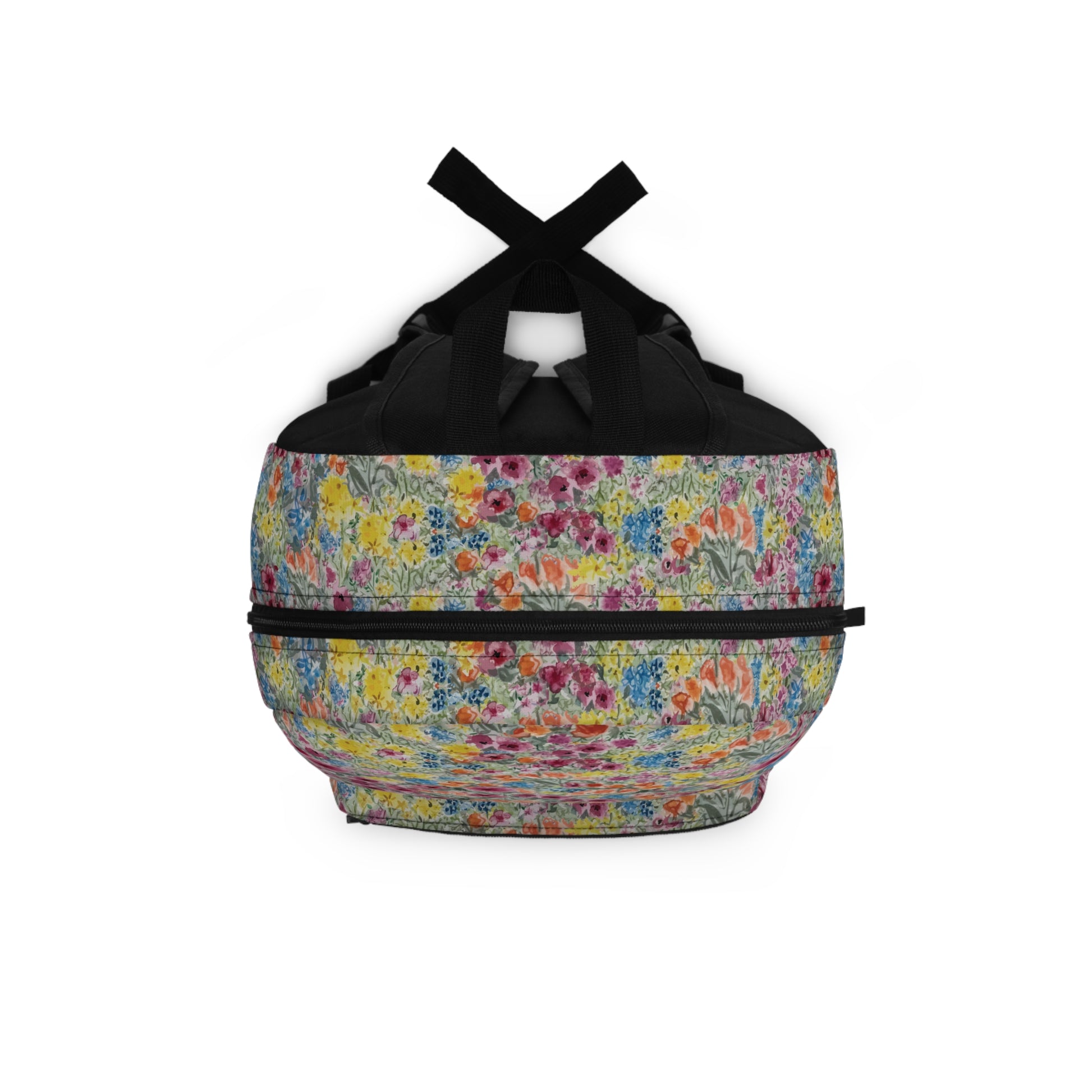Multicolored floral-patterned bag top view with black straps on a white background