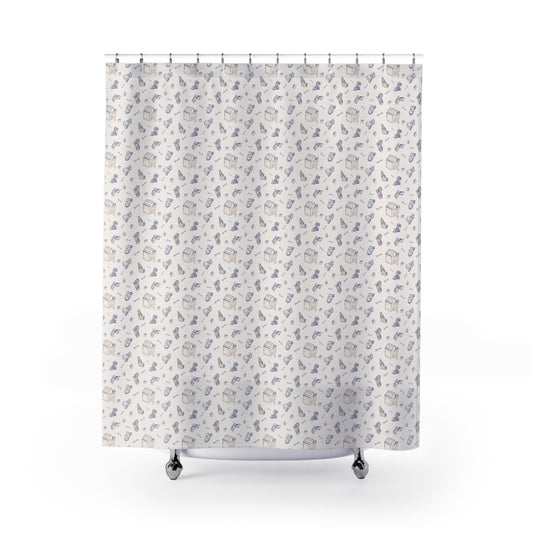 Blue and cream dog-themed shower curtain featuring a repeating hand-drawn pattern of puppies, dog houses, bones, and pet accessories on a soft neutral background in a bright, modern bathroom.