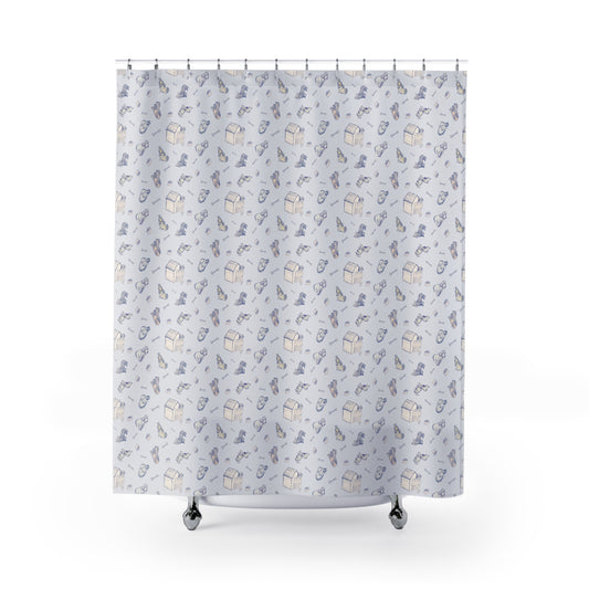 Blue and cream dog-themed shower curtain with a playful repeating pattern of hand-drawn puppies, dog houses, bones, food bowls, and pet accessories on a soft white background, displayed in a bright modern bathroom.