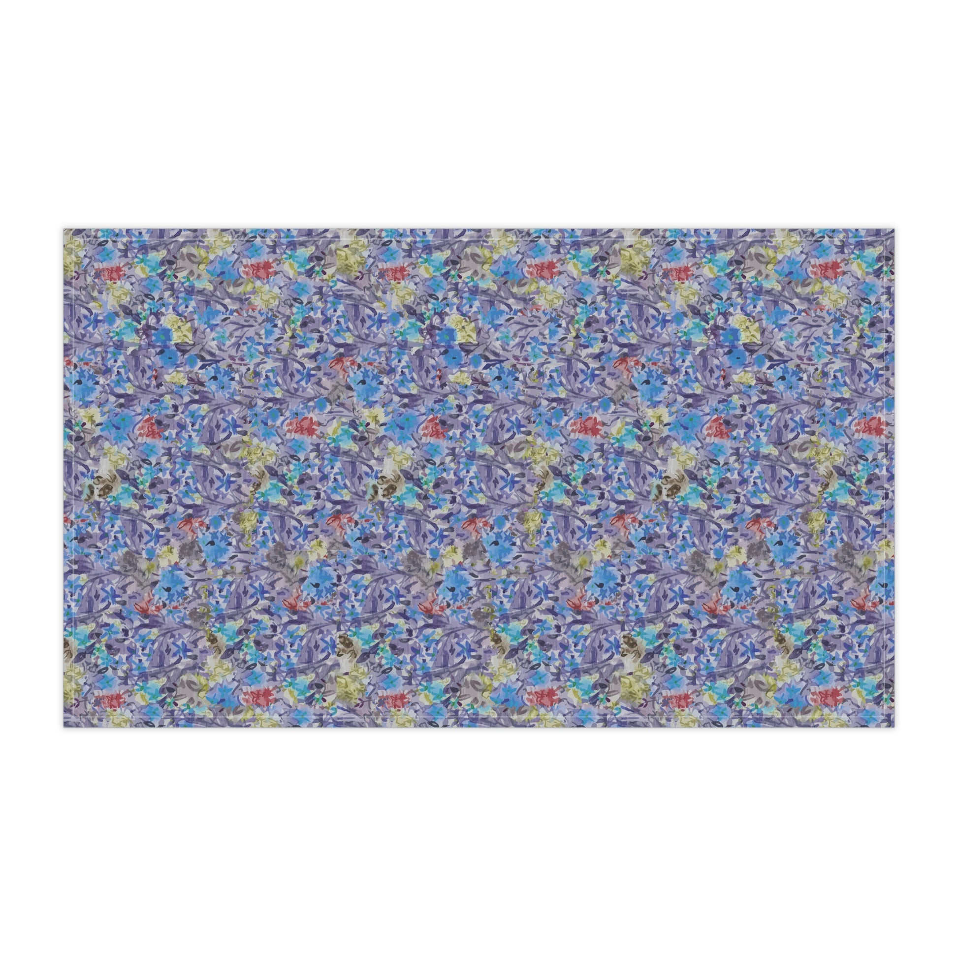 Watercolor floral tea towel with pink blossoms, earthy brown tones, and soft blue accents in a meadow-style pattern.