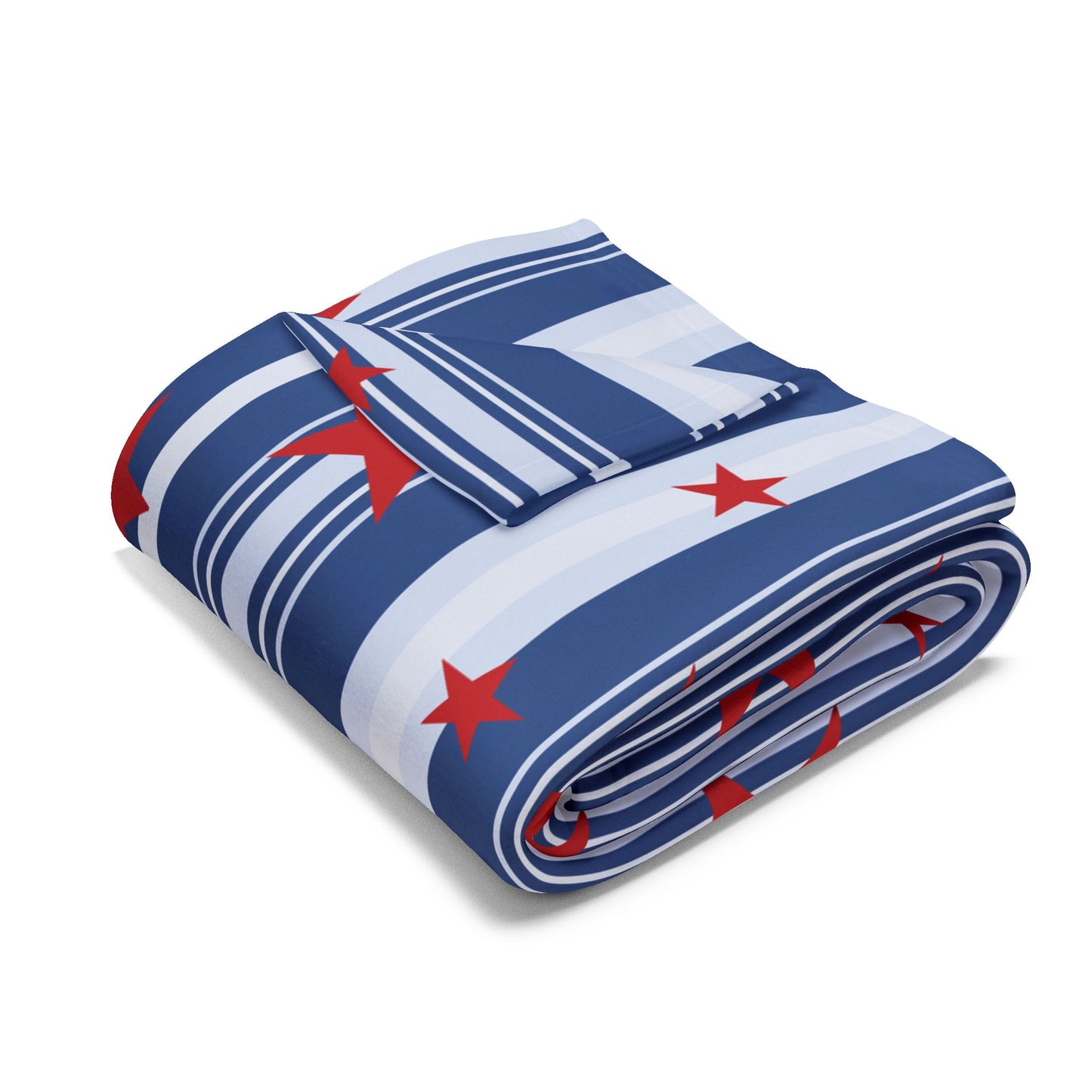 Folded blanket with blue, white, and red pattern on a white background
