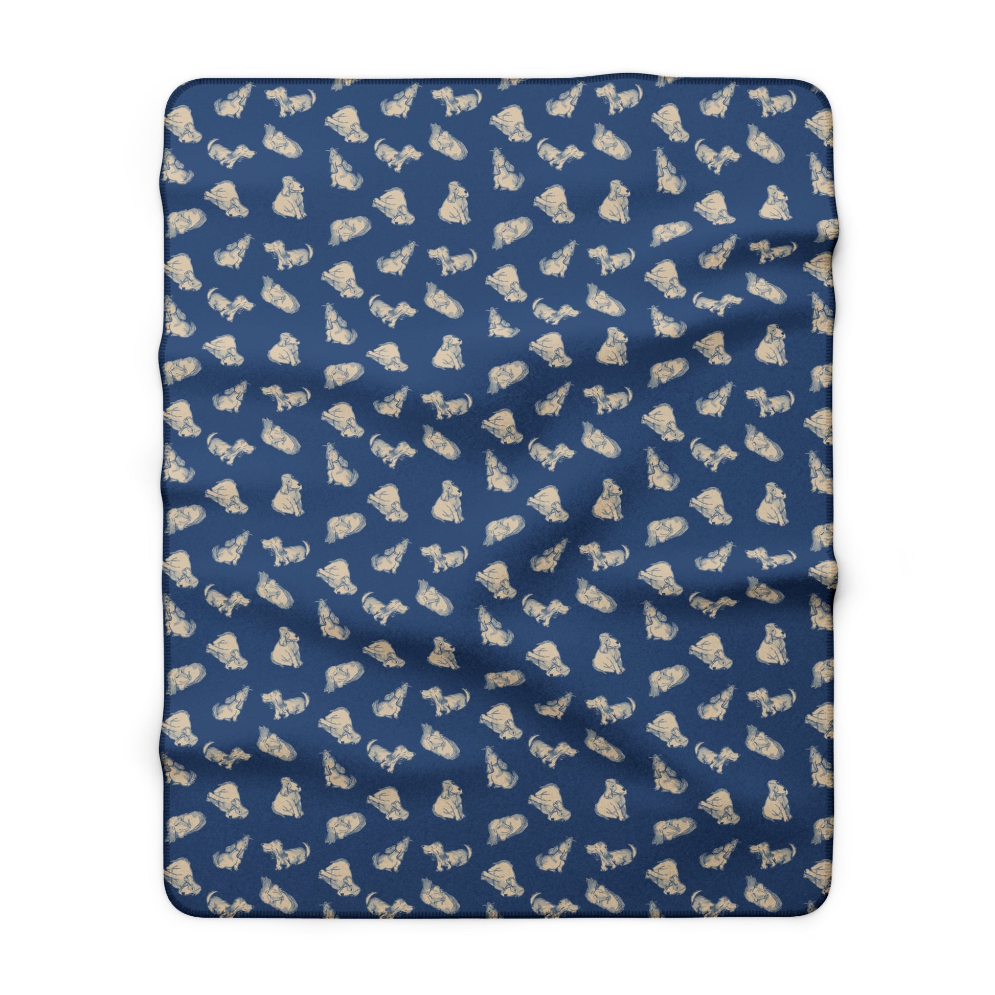 Blue blanket with beige dog pattern on a white background