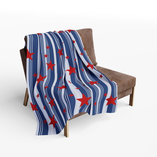 Blue and white striped blanket with red stars draped over a brown chair.