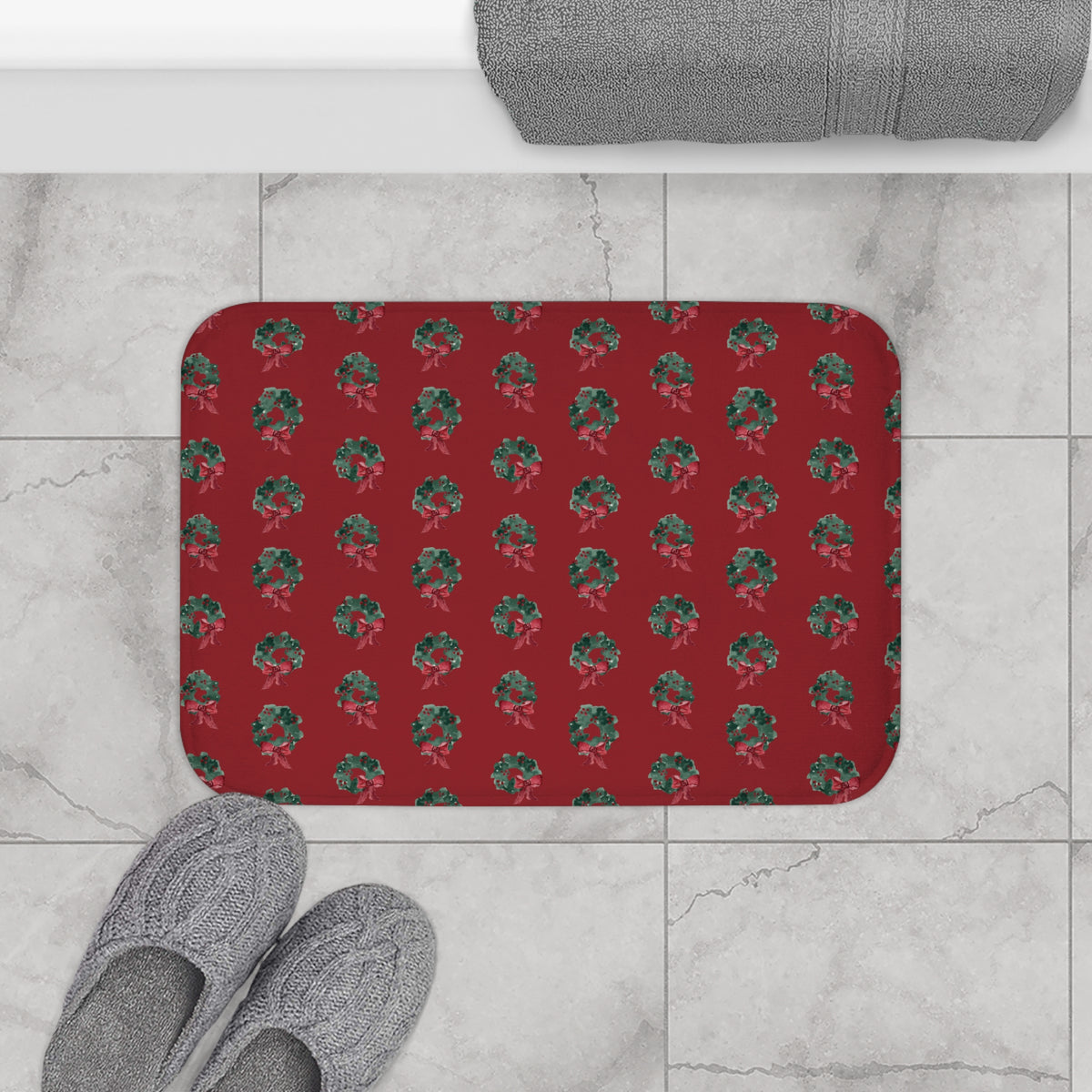 Evergreen Wreath Christmas Bath Mat – Red — on a bathroom floor