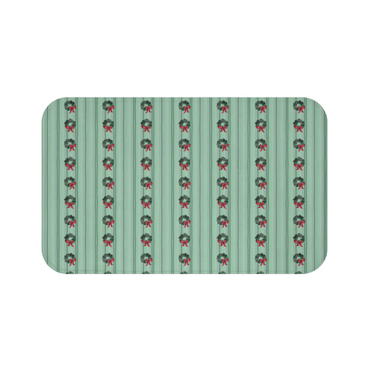 Memory foam bath mat with a festive hand-painted Christmas wreath design