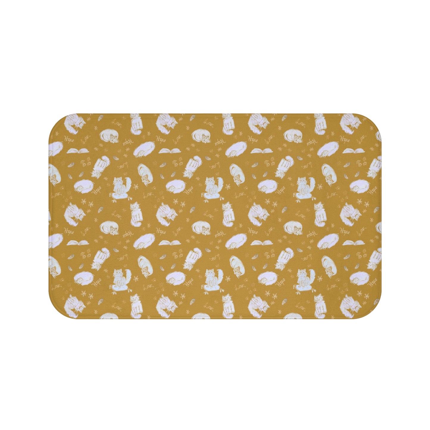 Mustard yellow bath mat featuring a cozy repeating pattern of sleeping and fluffy cats, books, stars, leaves, and handwritten words on a warm golden background, perfect for cat lovers and cozy home décor.