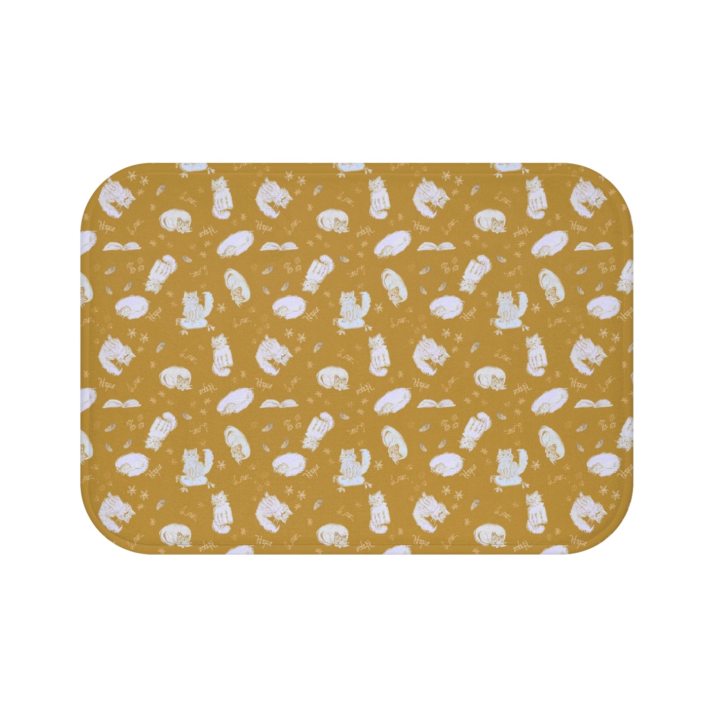 Mustard yellow bath mat featuring a cozy repeating pattern of sleeping and fluffy cats, books, stars, leaves, and handwritten words on a warm golden background, perfect for cat lovers and cozy home décor.