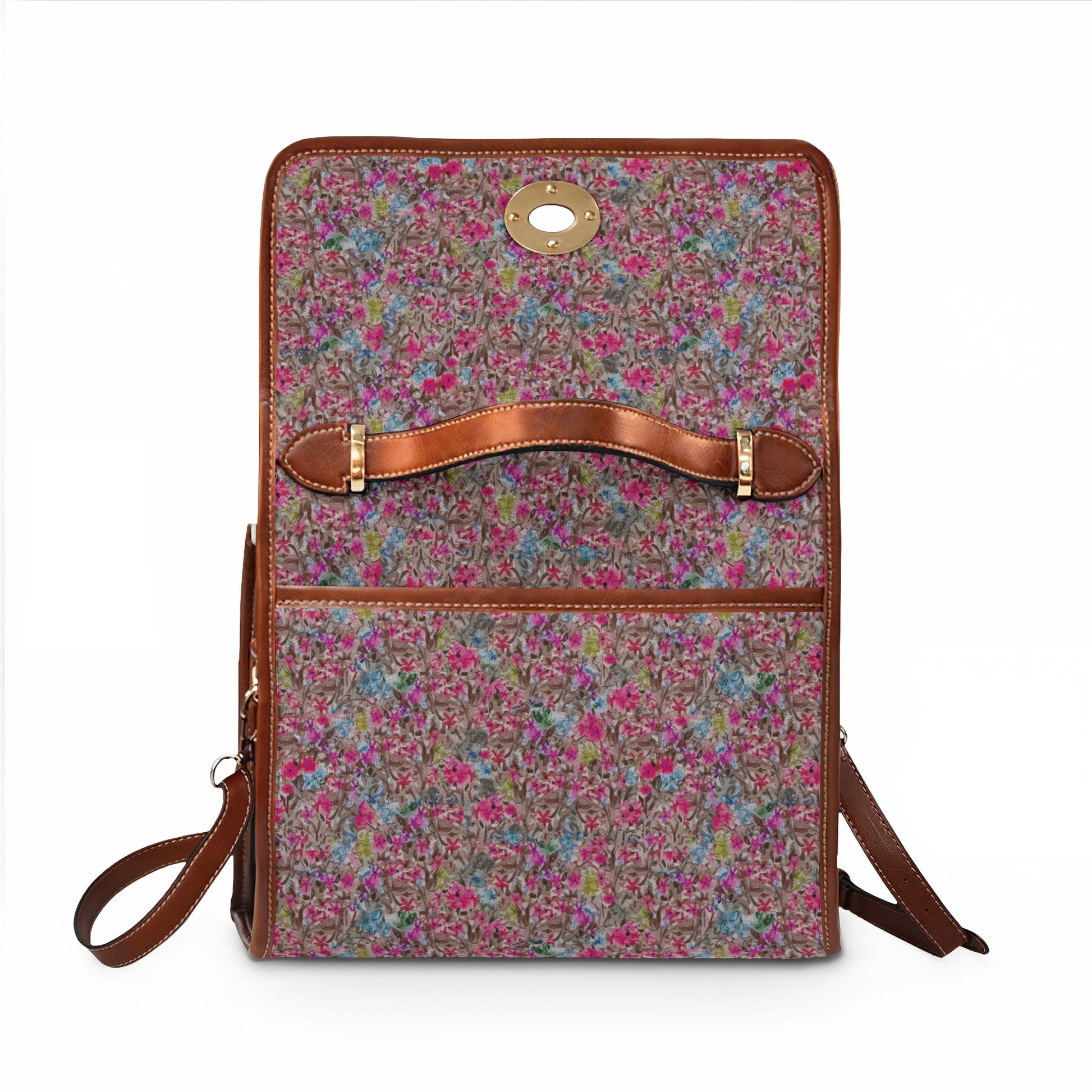 Watercolor wildflower print handbag featuring pink, blue, and green floral pattern with brown leather trim