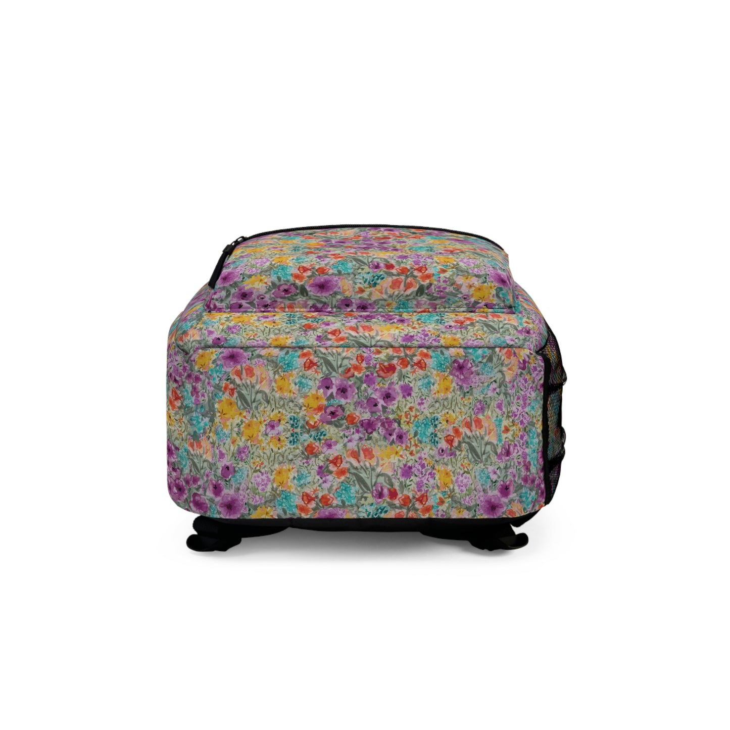 Meadow Blooms in Violets golds oranges and teals-patterned backpack bottom view on a white background