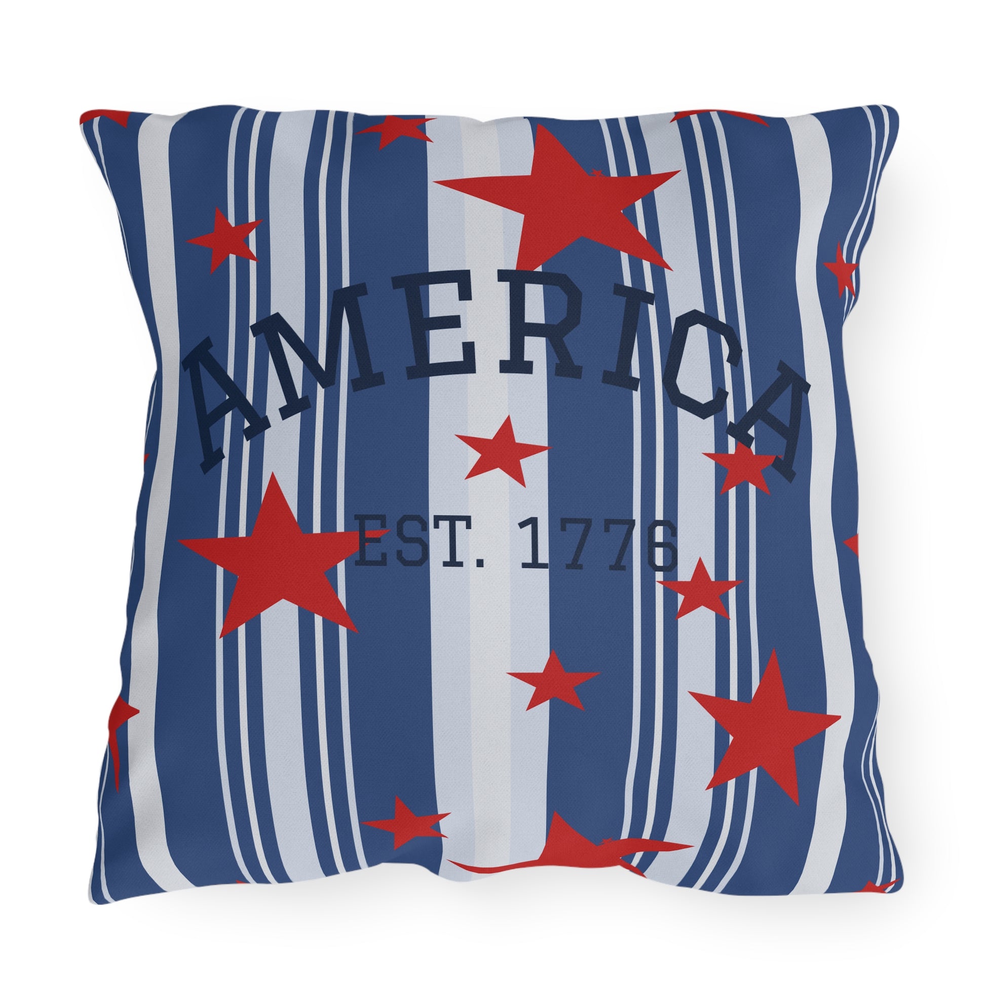 Pillow with red stars and blue stripes featuring the word 'AMERICA' and 'EST. 1776'.