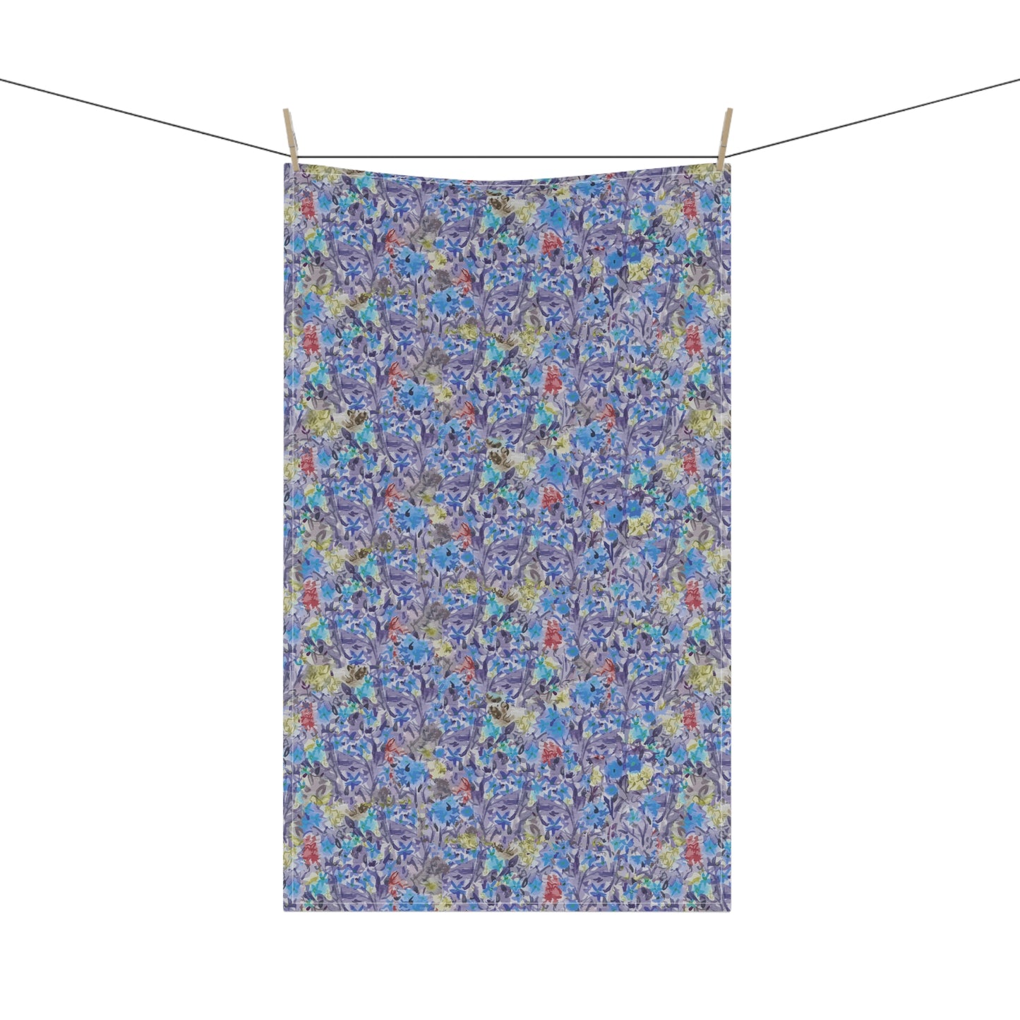 Watercolor floral tea towel with pink blossoms, earthy brown tones, and soft blue accents in a meadow-style pattern.