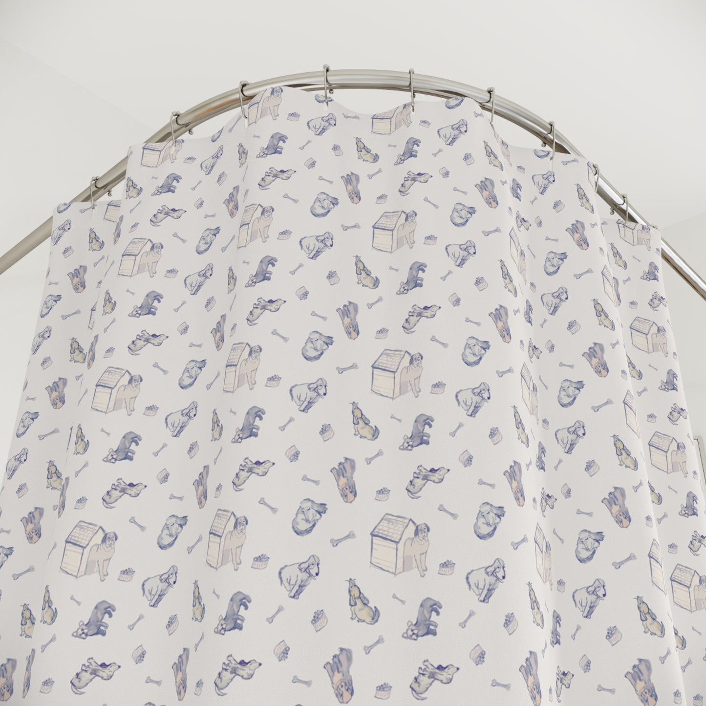 Blue and cream dog-themed shower curtain featuring a repeating hand-drawn pattern of puppies, dog houses, bones, and pet accessories on a soft neutral background in a bright, modern bathroom.