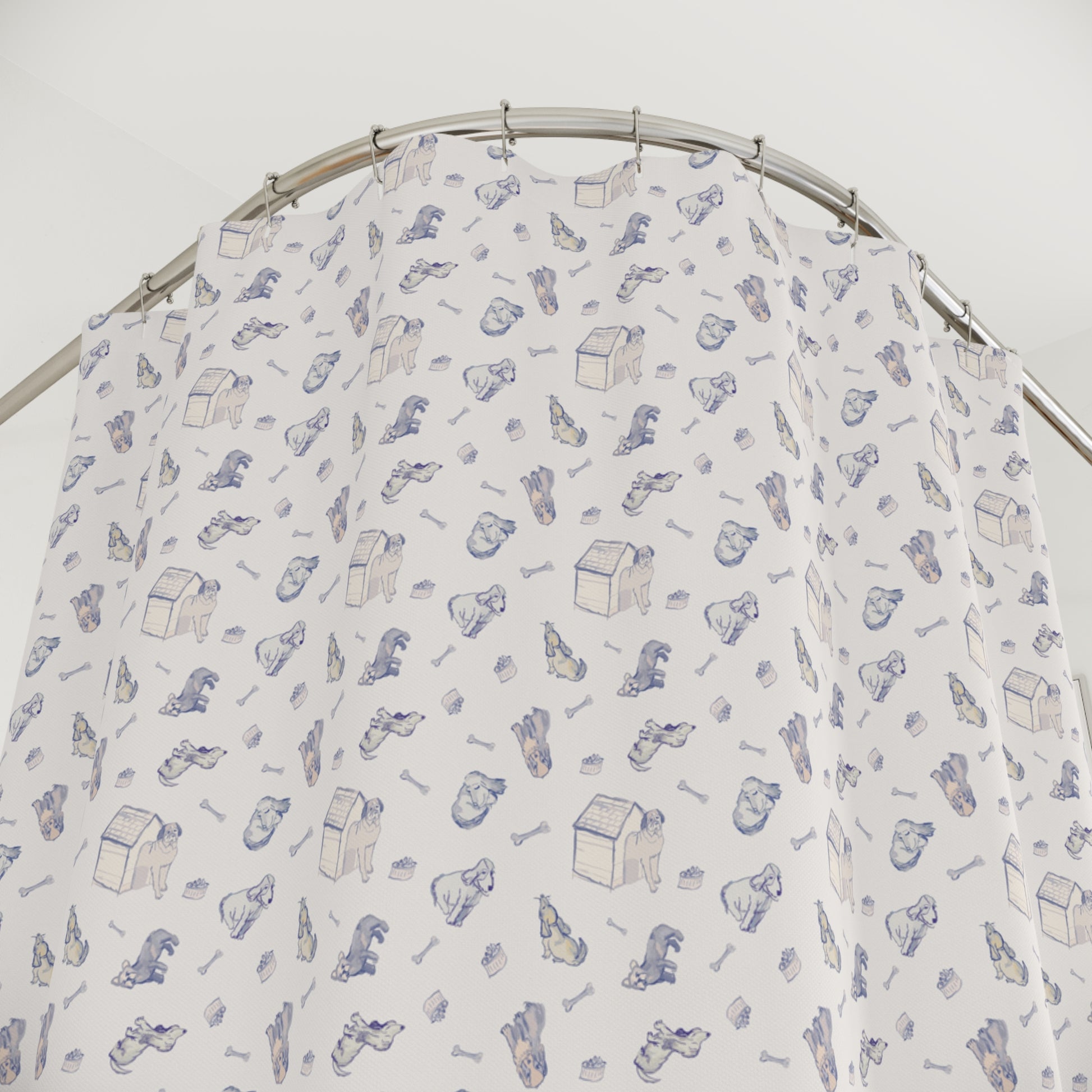 Blue and cream dog-themed shower curtain featuring a repeating hand-drawn pattern of puppies, dog houses, bones, and pet accessories on a soft neutral background in a bright, modern bathroom.