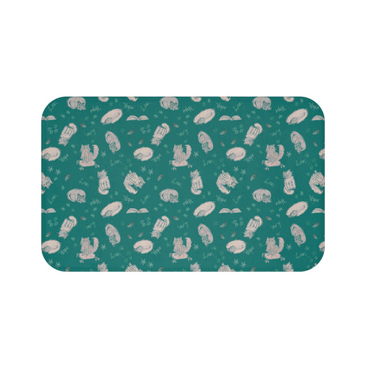 Teal cat-themed bath mat featuring a cozy repeating pattern of sleeping and fluffy cats, books, stars, leaves, and handwritten details in soft cream on a rich jewel-toned background, perfect for cozy cat lover bathroom décor.