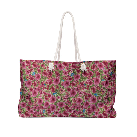 Pink Poppy watercolor patterned bag with white handles on a white background
