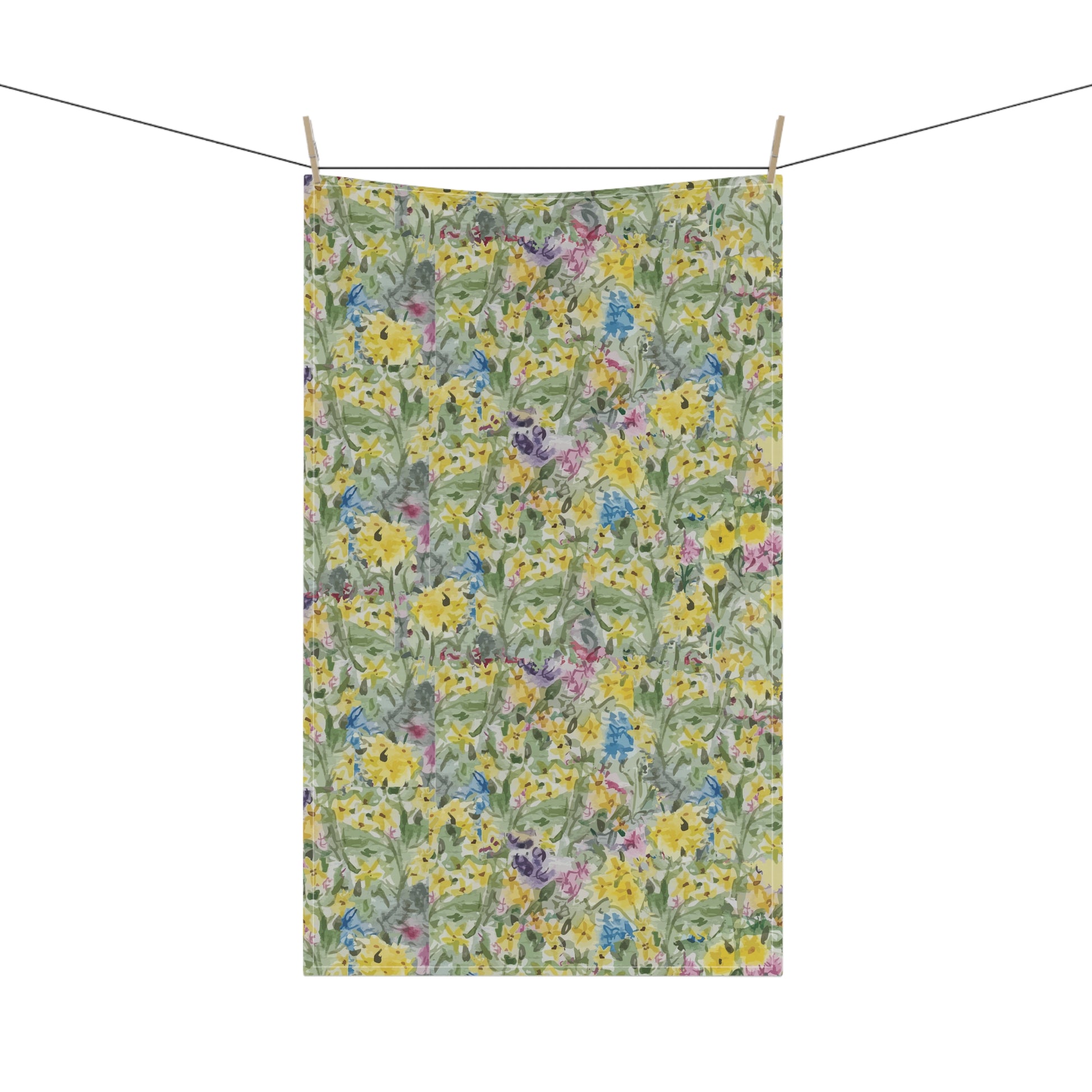 Watercolor wildflower tea towel featuring yellow, blue, and pink floral meadow pattern 