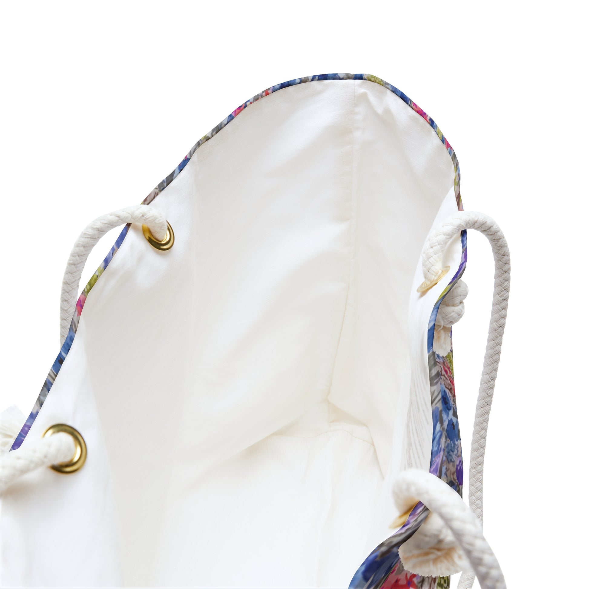 White inside of Blue and pink watercolor wildflower weekender bag with a vibrant meadow floral pattern and white rope handles, designed as a spacious travel tote for beach trips and weekend getaways.
