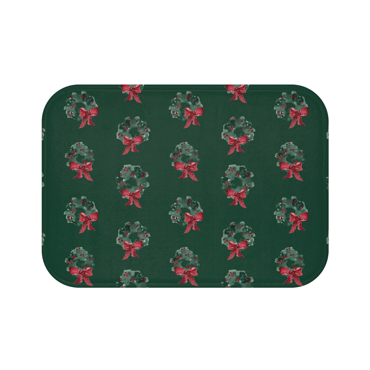 Bath mat with hand-painted evergreen wreaths and red bows on dark green