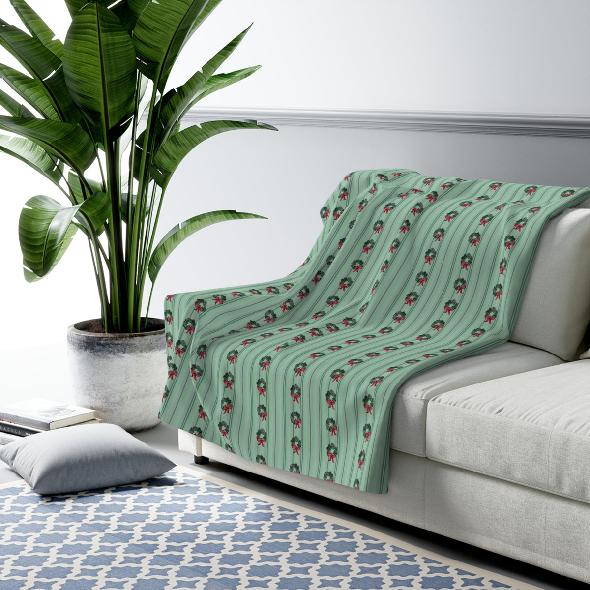 Floral Watercolor Sherpa Fleece Blanket — draped over a sofa