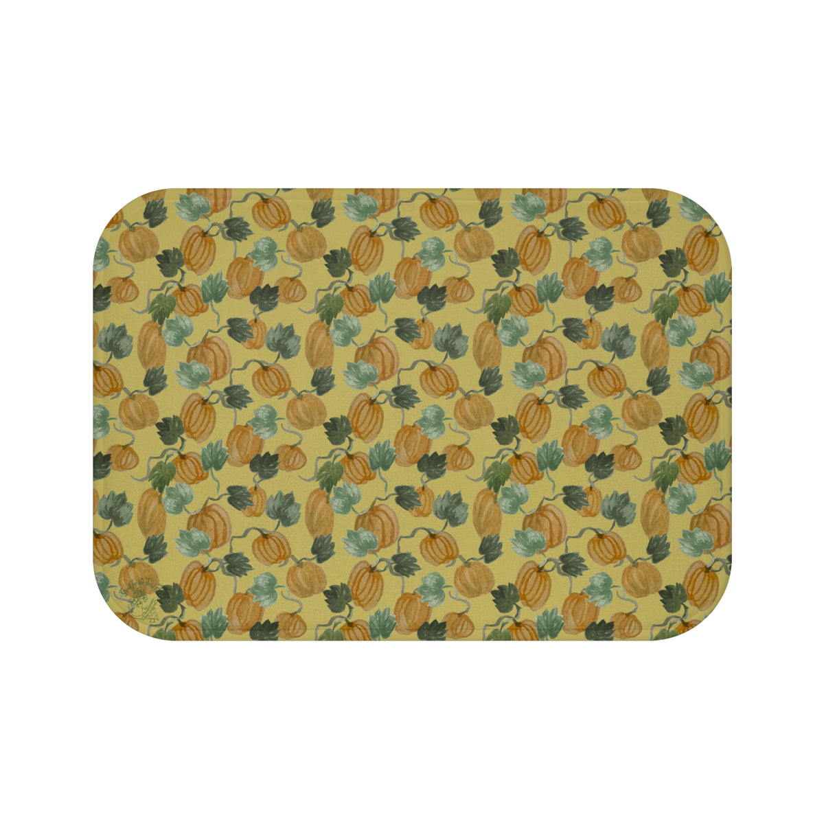 Memory foam bath mat with hand-painted pumpkins and curling vines in muted orange and sage on warm gold