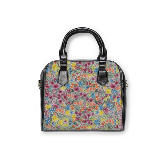 Watercolor wildflower handbag with colorful floral meadow pattern and black leather handles