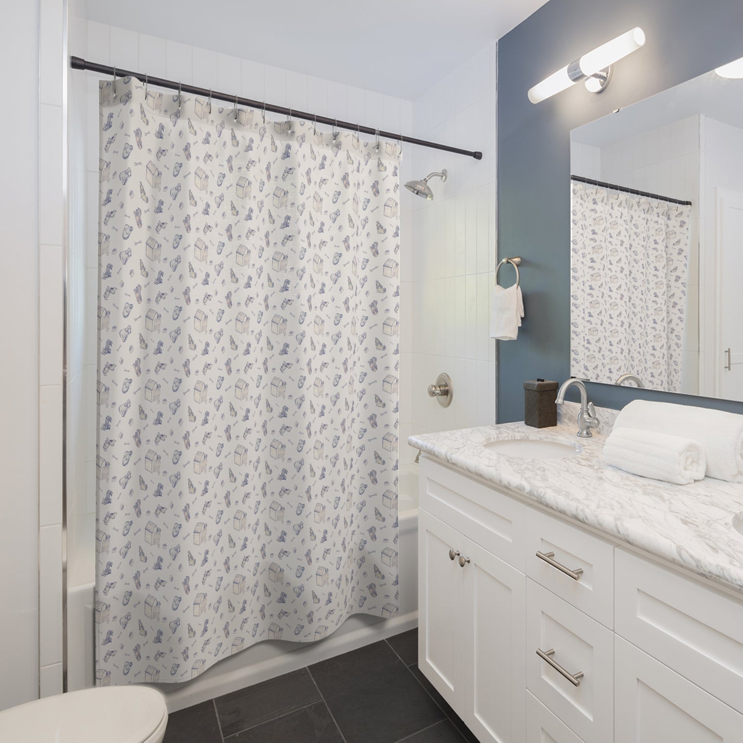 Blue and cream dog-themed shower curtain featuring a repeating hand-drawn pattern of puppies, dog houses, bones, and pet accessories on a soft neutral background in a bright, modern bathroom.