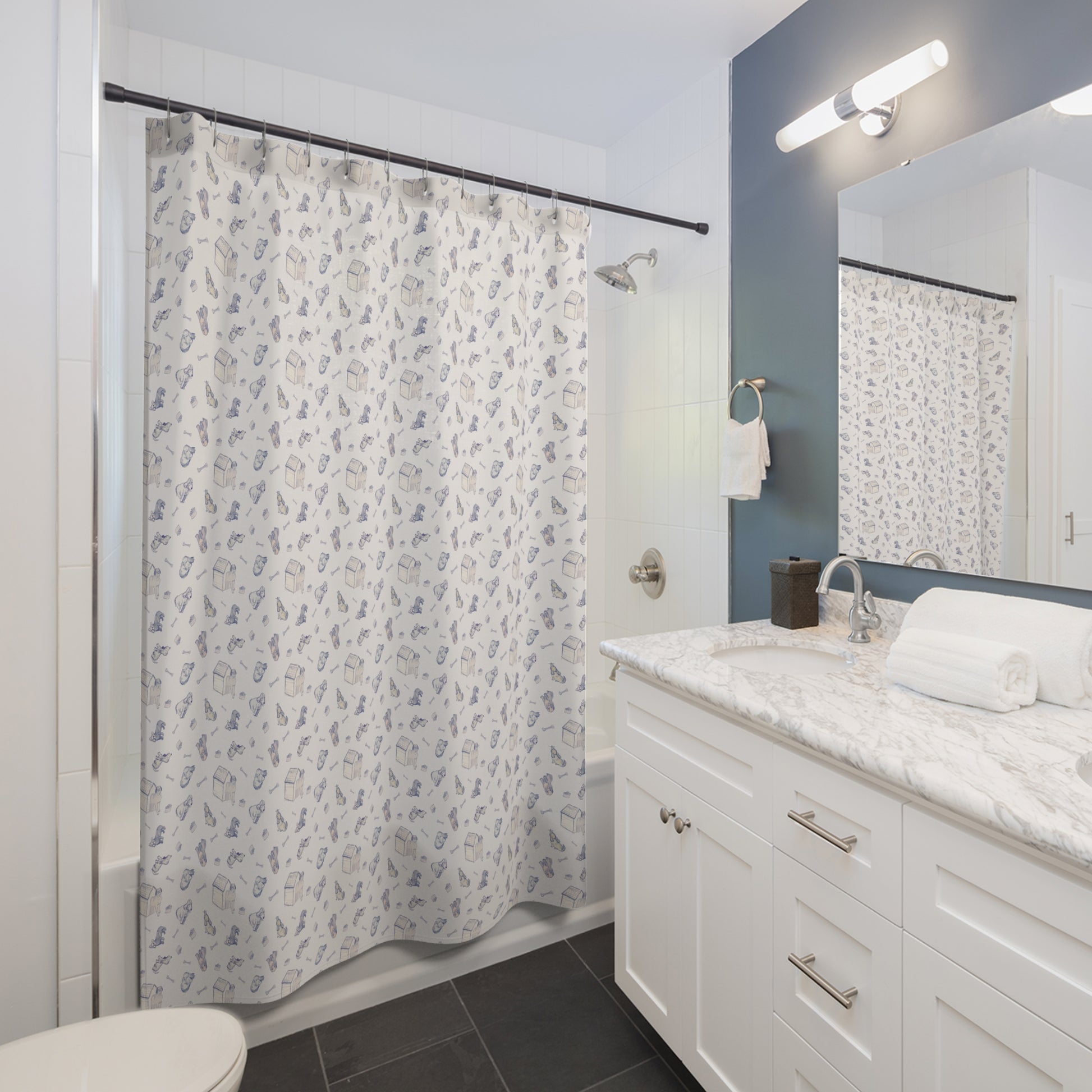 Blue and cream dog-themed shower curtain featuring a repeating hand-drawn pattern of puppies, dog houses, bones, and pet accessories on a soft neutral background in a bright, modern bathroom.