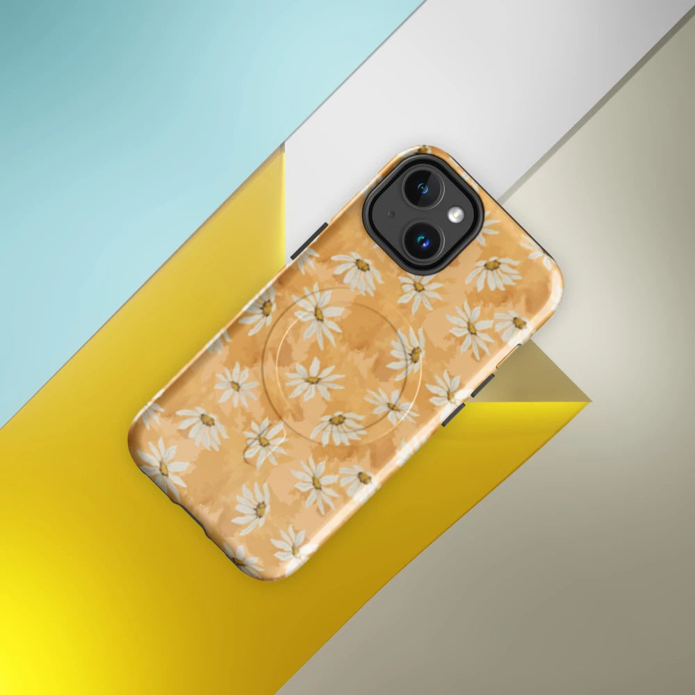 Phone case with white daisy pattern on a warm multi tone peach background