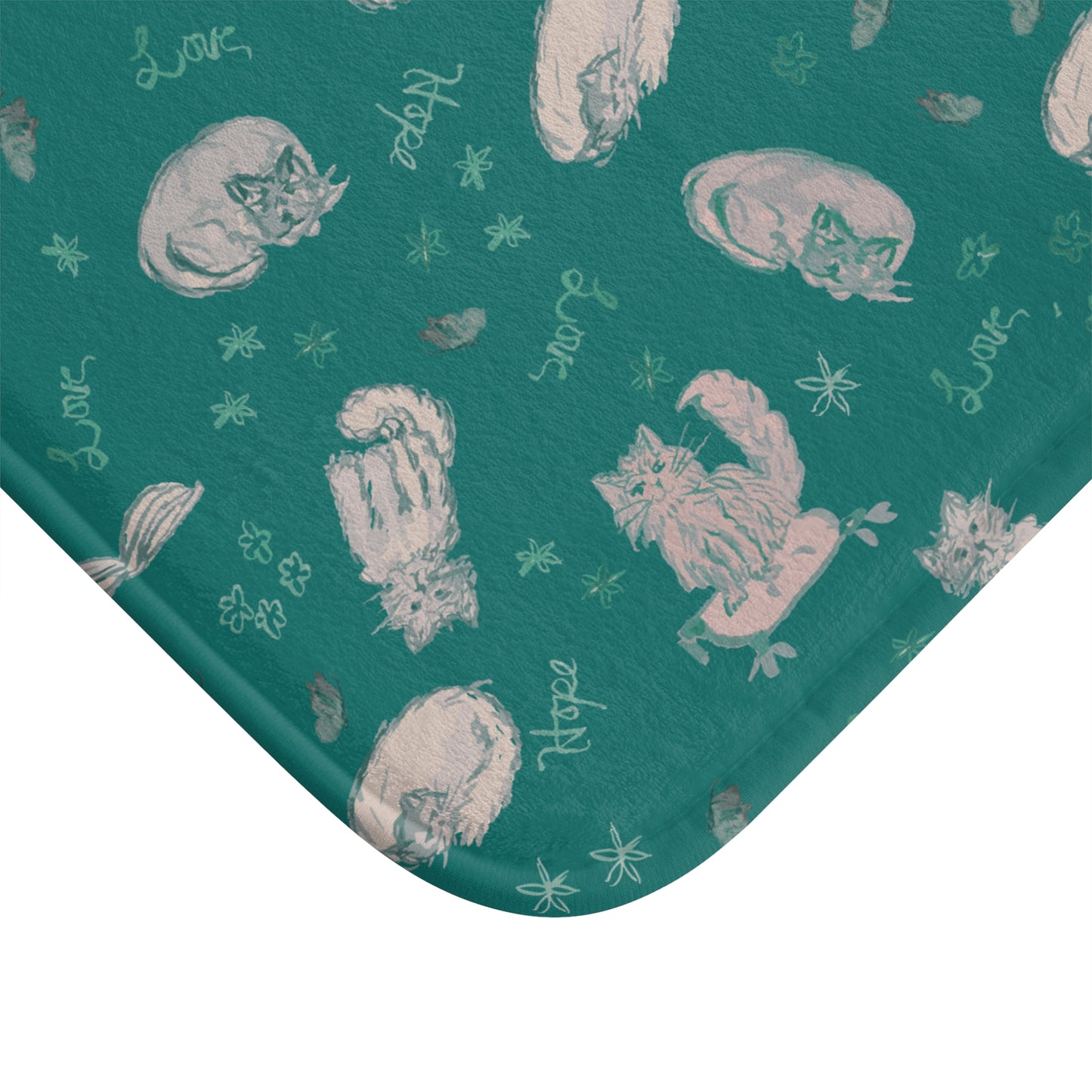 Teal fabric with white cat illustrations and text on a white background