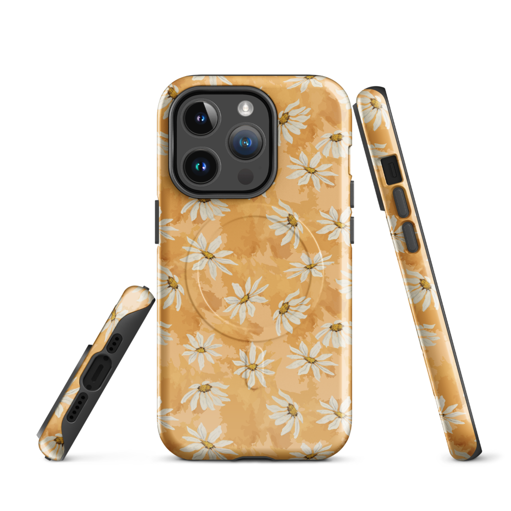 Phone case with white daisy pattern on a warm multi tone peach background