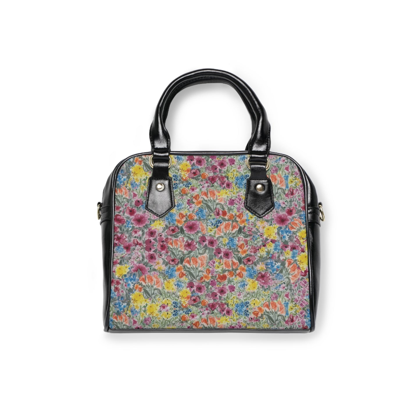 Floral handbag with watercolor wildflower print in pink, yellow, blue, and green with structured black handles