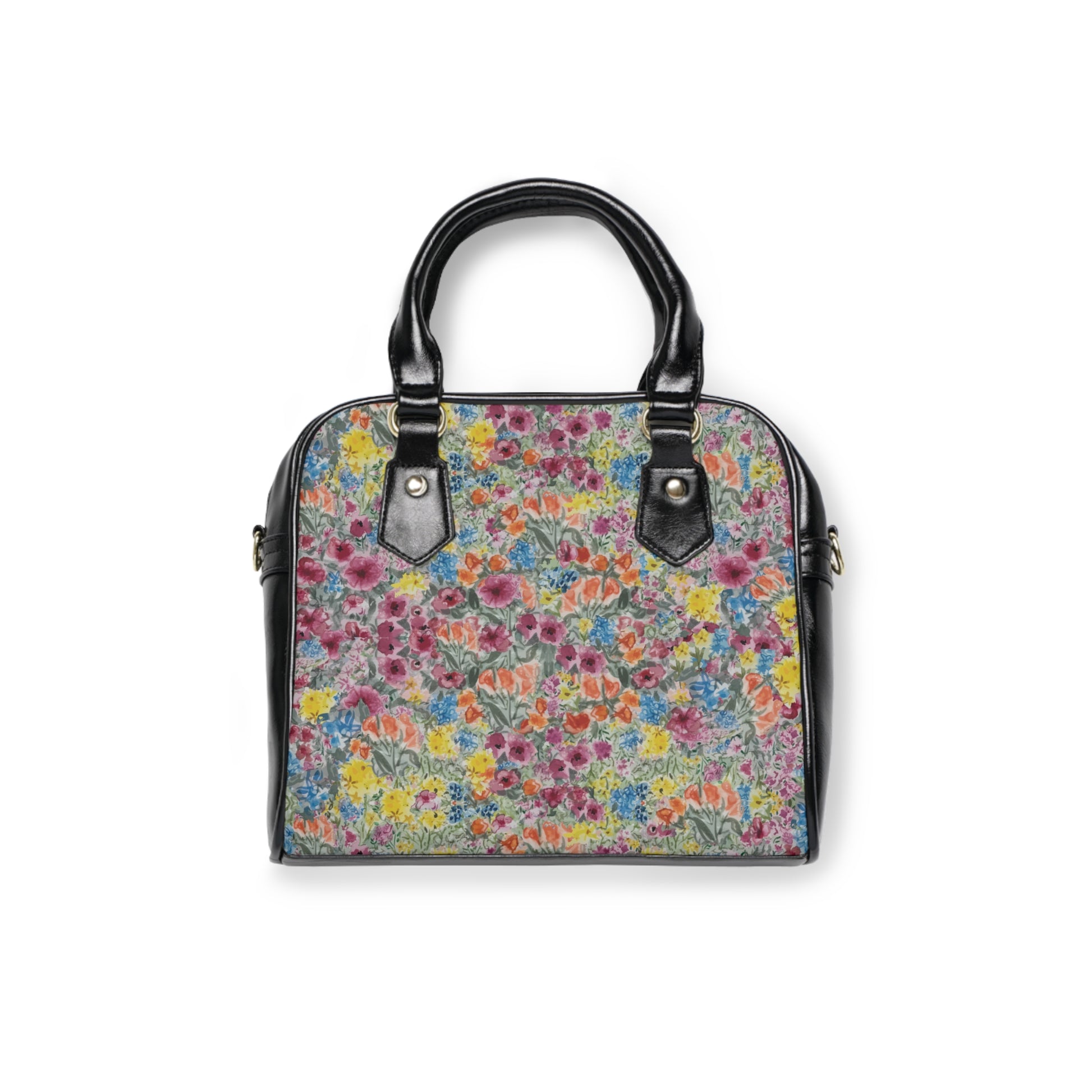 Floral handbag with watercolor wildflower print in pink, yellow, blue, and green with structured black handles