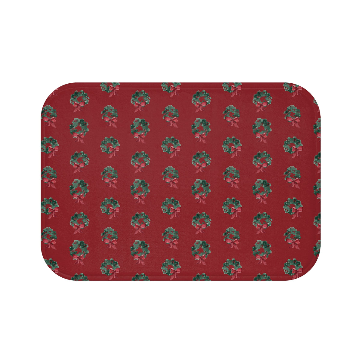 Bath mat with hand-painted evergreen wreaths on red