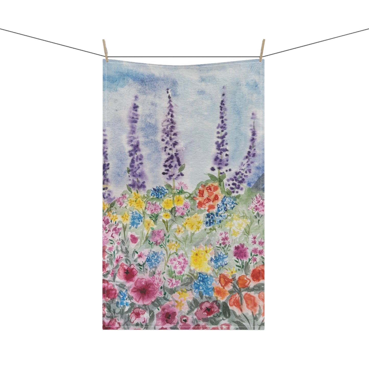 Watercolor floral tea towel featuring lavender stems and colorful wildflowers in soft blue, purple, pink, and yellow tones on a light background.