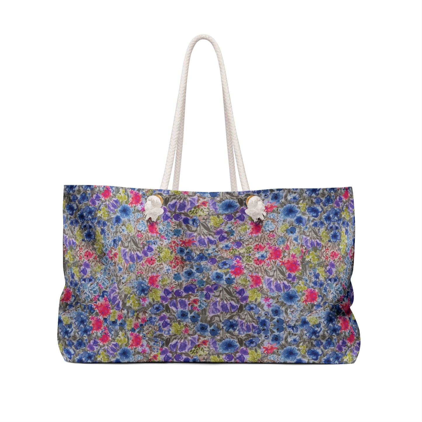 Blue and pink watercolor wildflower weekender bag with a vibrant meadow floral pattern and white rope handles, designed as a spacious travel tote for beach trips and weekend getaways.