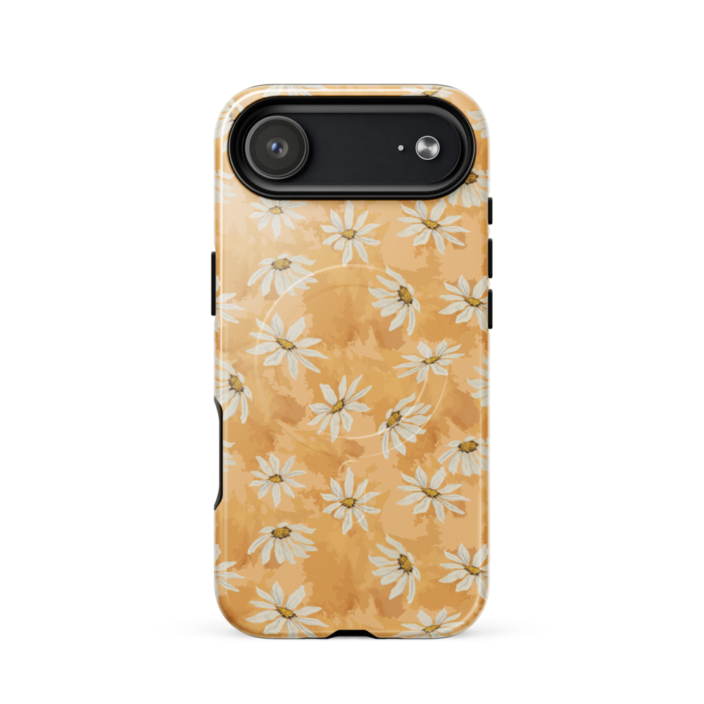 Phone case with white daisy pattern on a warm multi tone peach background