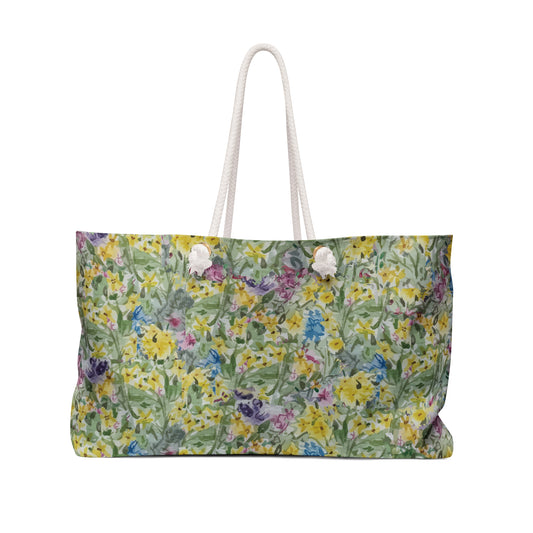 Watercolor wildflower floral weekender tote bag with yellow meadow flowers and green botanical pattern.