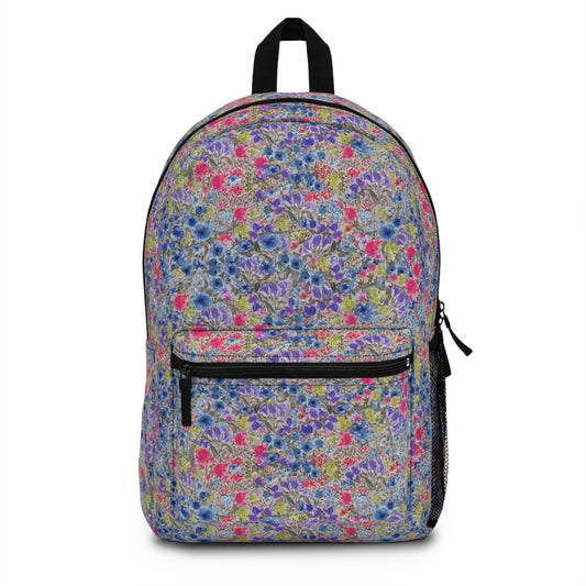 Front view of Floral Fields watercolor wildflower backpack featuring colorful meadow flowers on a soft neutral background.