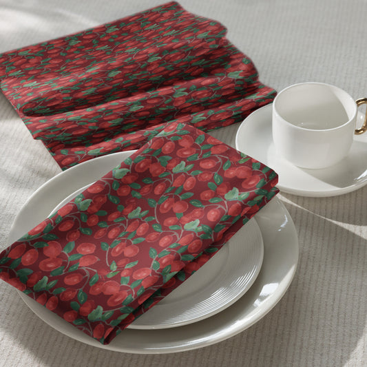 Set of four cloth napkins in Kathryn Young's Cranberry Vine pattern of painterly red cranberries and green vines on a light background