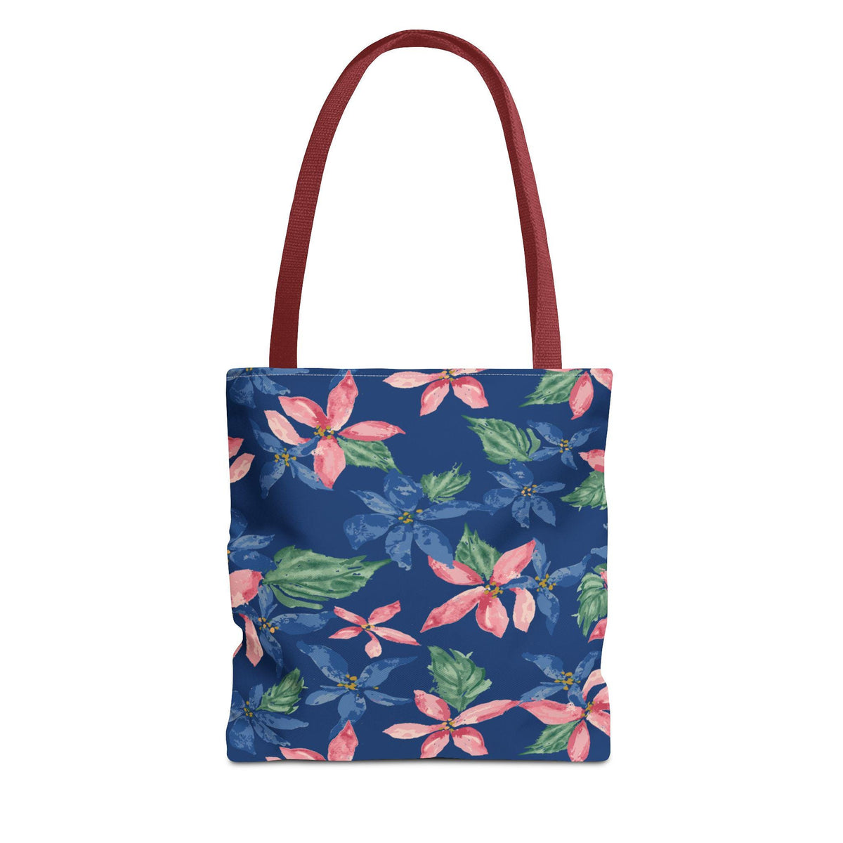 A tote bag with a dark blue background and a floral pattern of pink and blue flowers with green leaves. The bag has burgundy-colored handles.