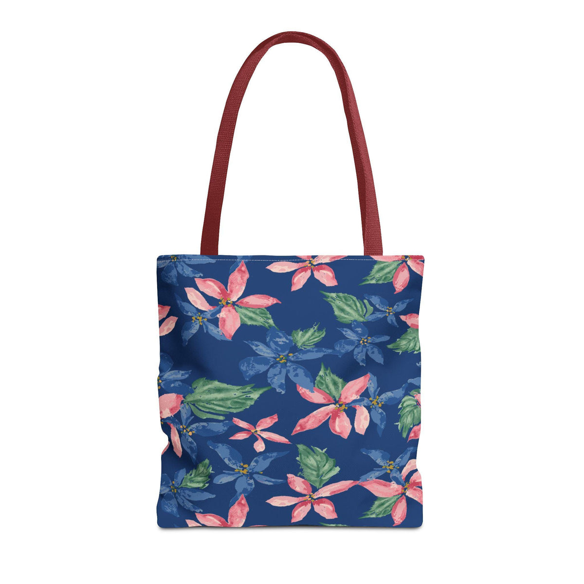 A tote bag with a navy blue background and a floral pattern of pink and blue flowers with green leaves. The bag has burgundy-colored handles.