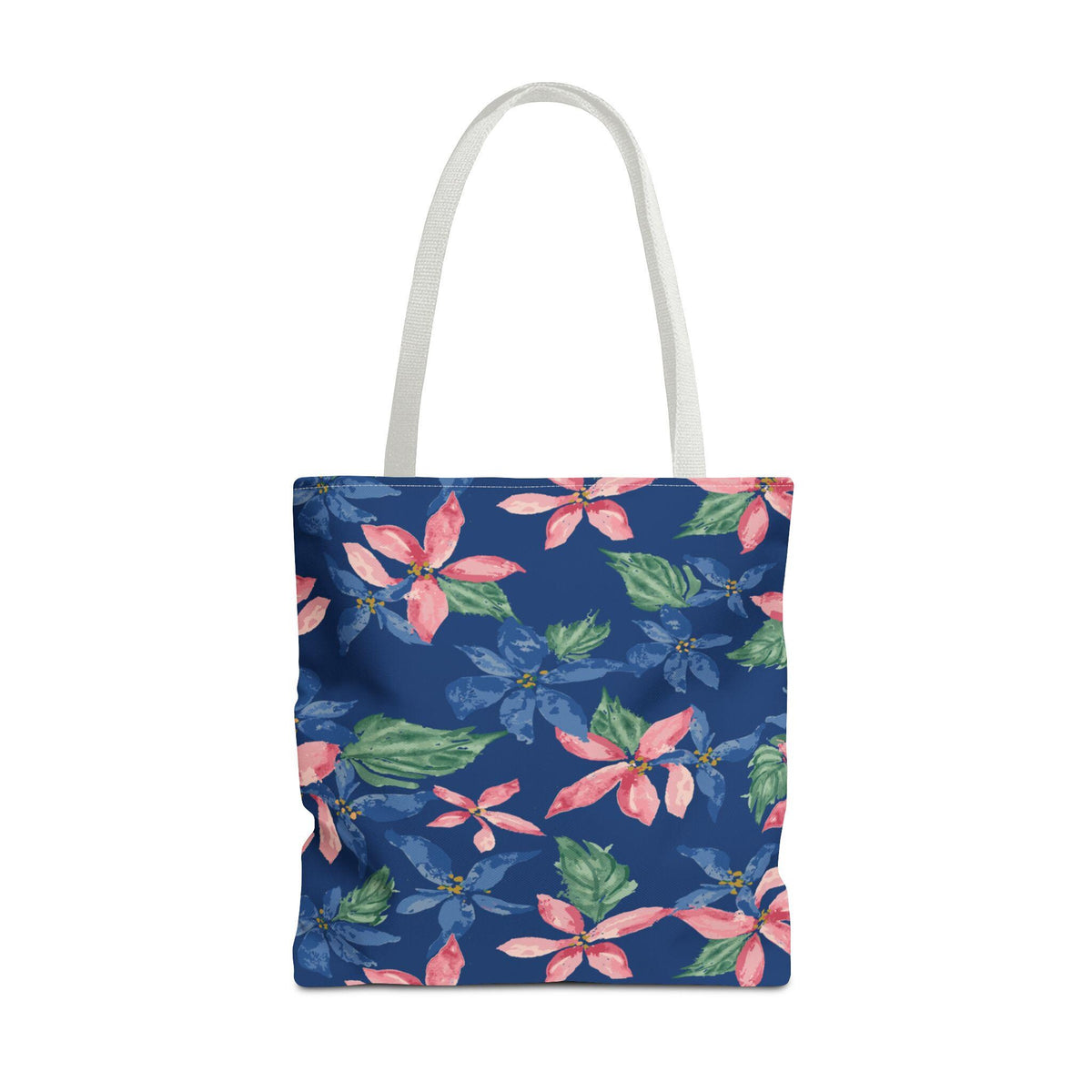 A tote bag with a white handle and a navy blue background. The bag is covered in a floral pattern of pink and blue flowers with green leaves. The flowers are in a watercolor style.