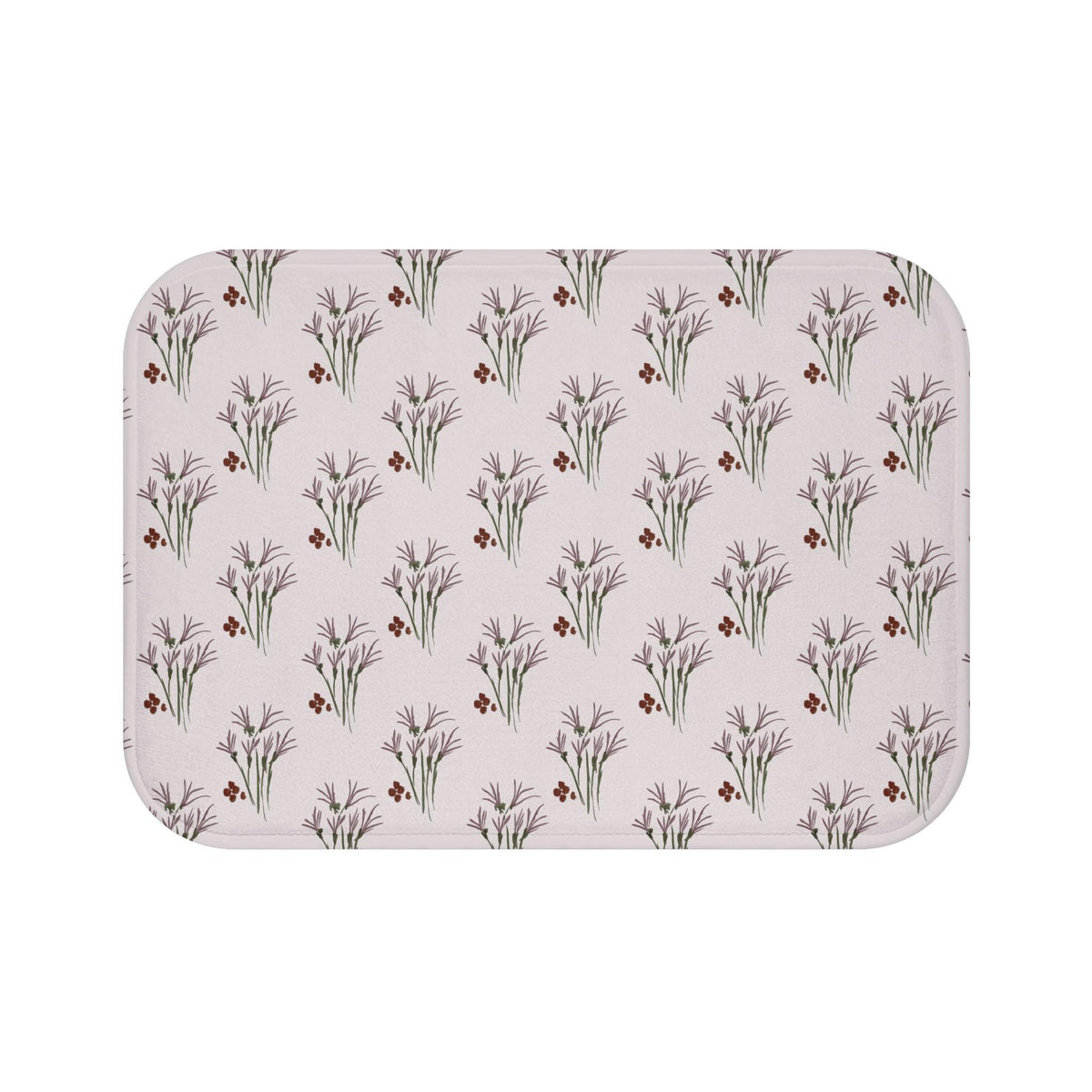 Rectangular bath mat with a repeating pattern of purple floral bouquets and small red berry clusters on a light pink background. The mat has rounded corners and a soft, inviting appearance.