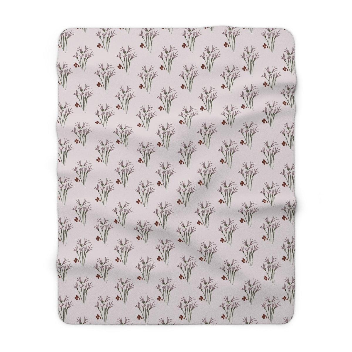 A soft, rectangular blanket with a repeating pattern of stylized floral sprigs and small red berries on a light pink background. The blanket is made of a plush material, perfect for snuggling.