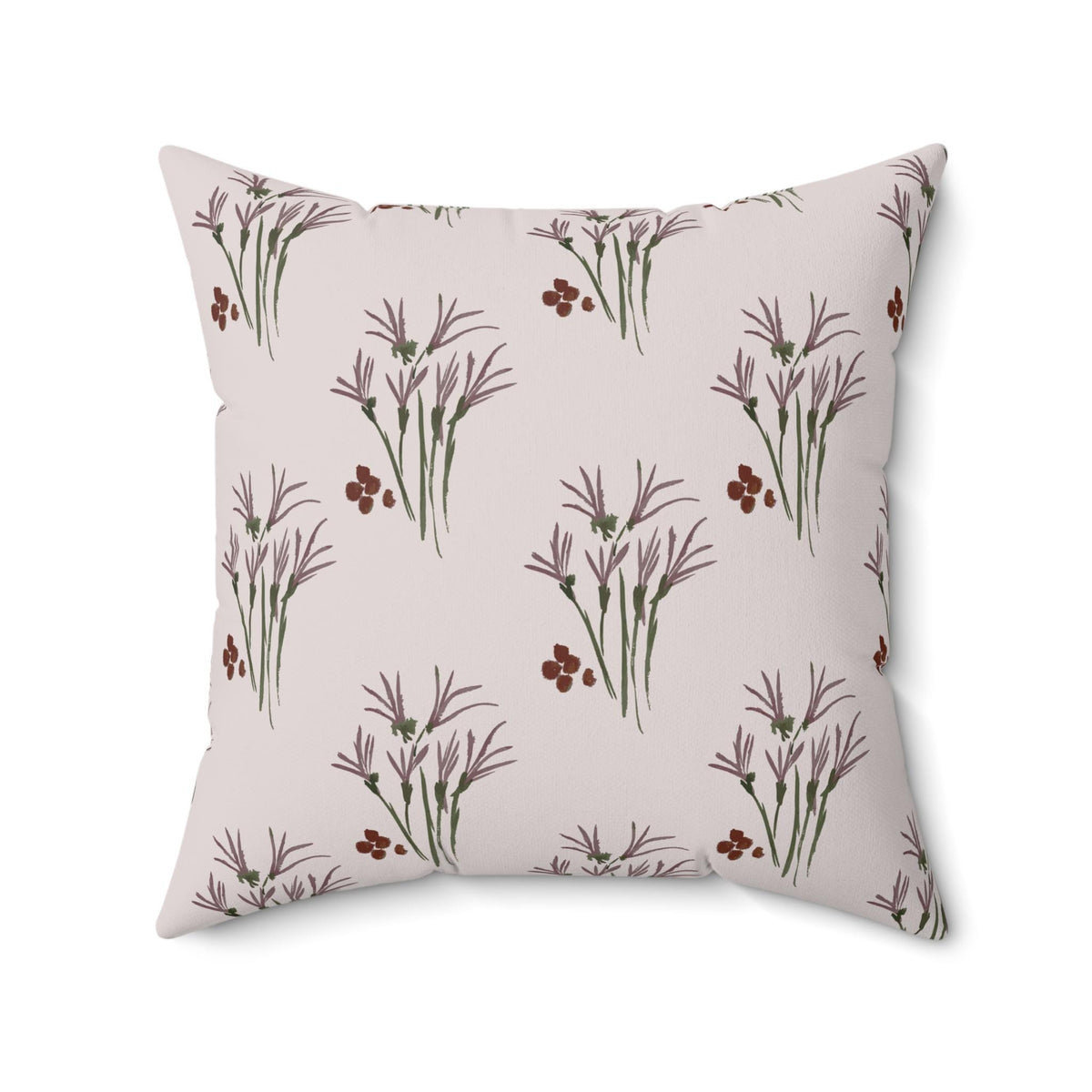 Square throw pillow with a repeating pattern of stylized purple and green floral elements on a light pink background. The design features clusters of small, dark red dots interspersed among the floral motifs.