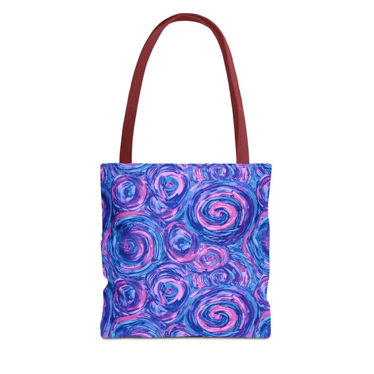 A tote bag with a vibrant, abstract design. The bag features a pattern of swirling blue and pink shapes, with a deep red handle. The bag is designed for carrying items and has a simple, functional design.