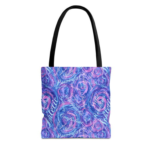 A tote bag with a black handle and a vibrant, swirling pattern in shades of blue and purple. The design includes white text with words like "Athletic", "Confident", and "Powerful".