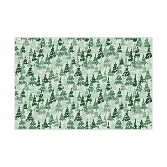 Christmas gift wrap paper printed with an evergreen pine watercolor pattern by Kathryn Young